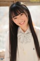 A young woman with long black hair and a bow tie.